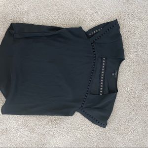 Ann Taylor black bouse with beautiful details around the neck.